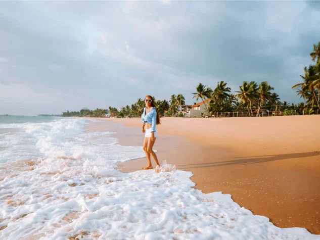 beautiful-young-lady-enjoying-the-beach-in-pasikudah